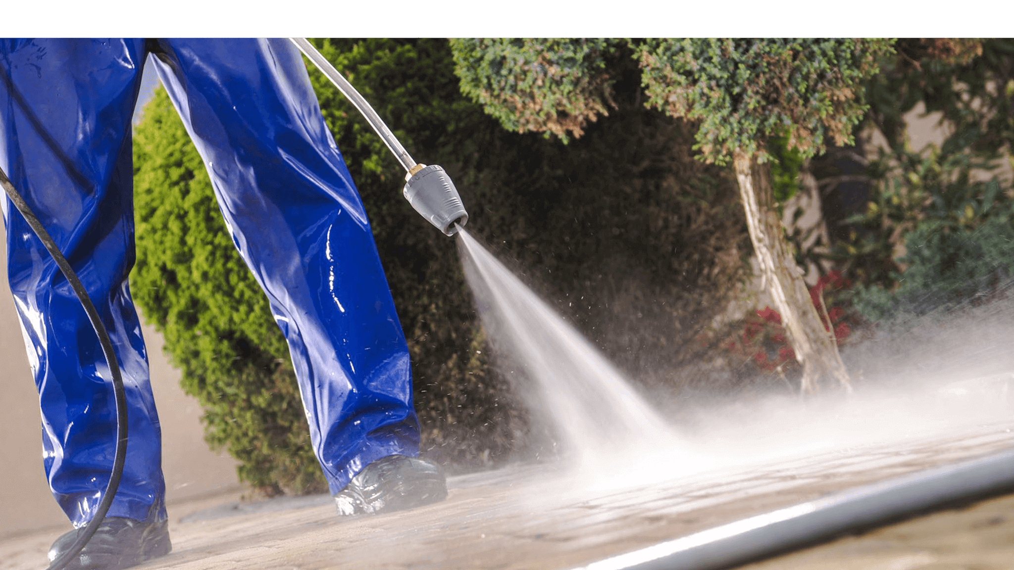 man-about-to-finish-power-washing-driveway